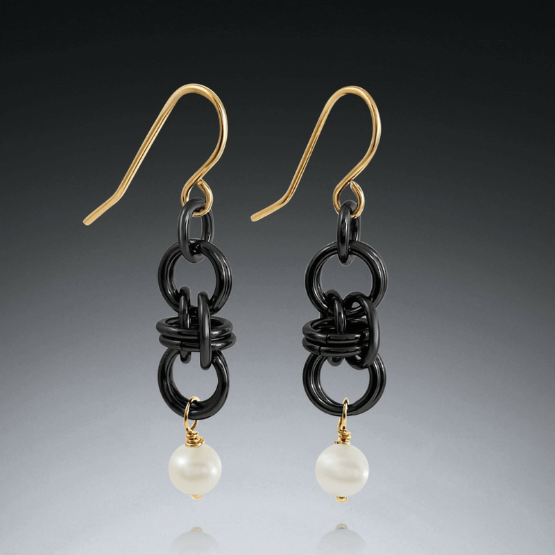 Black and gold barrel earrings